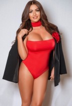 Mature escort Christina wearing a cream coloured dress tt