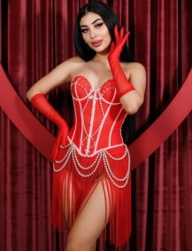 London escort Leonie showing off her gorgeous curvy figure