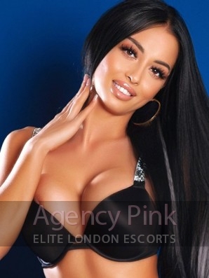 Escort Larissa with long dark hair in her white dress Picture 1