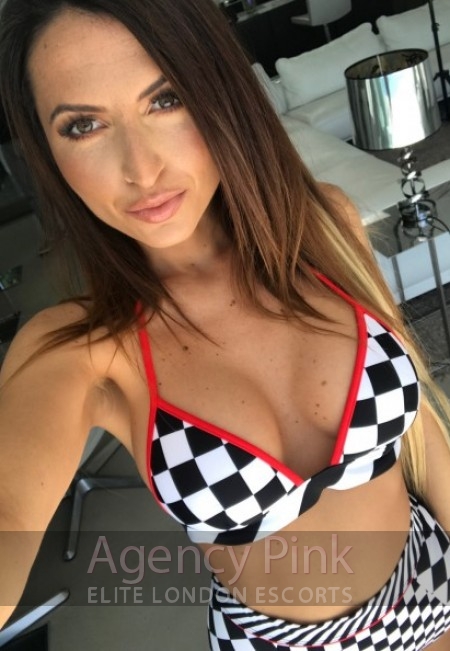 London escort selfie for Faith in her black and white bikini