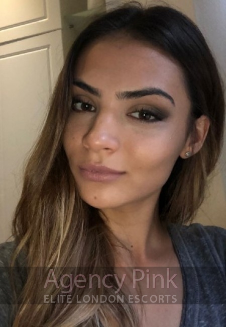 Kyra escort selfie photo showing off her gorgeous natural features