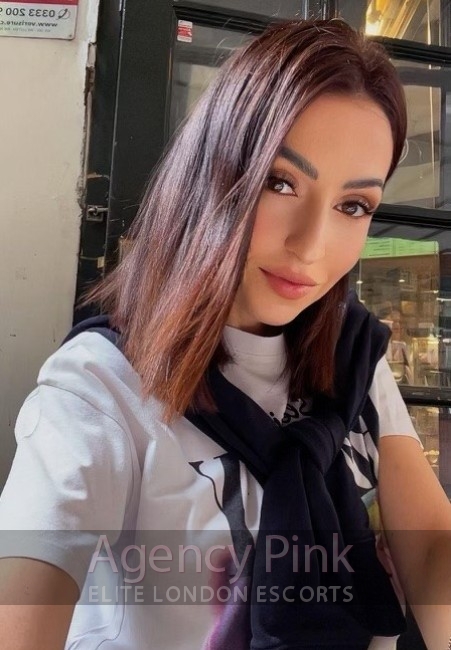 London escort selfie for Faith in her black and white bikini