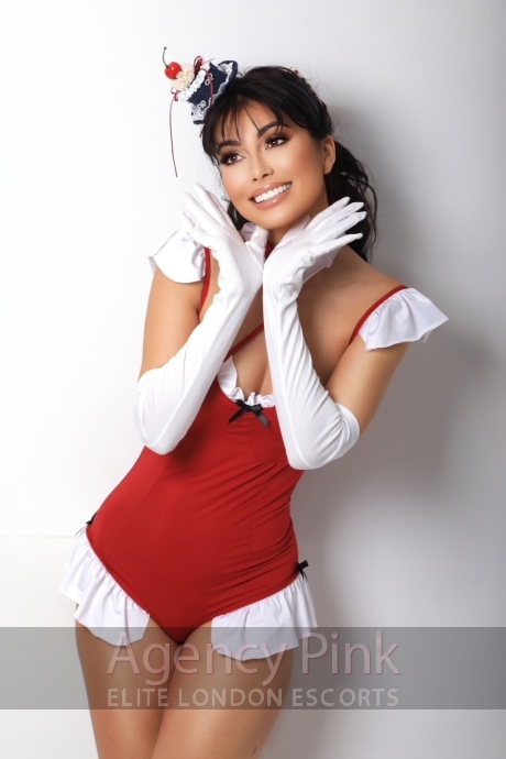 Topless escort Naomi posing in her green underwear set on the bed Picture 8