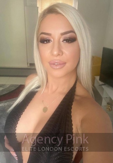 Natural escort selfie of Sasha with her long blonde hair
