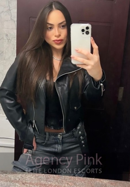 Paola dressed in her sexy outfit for her London escort profile